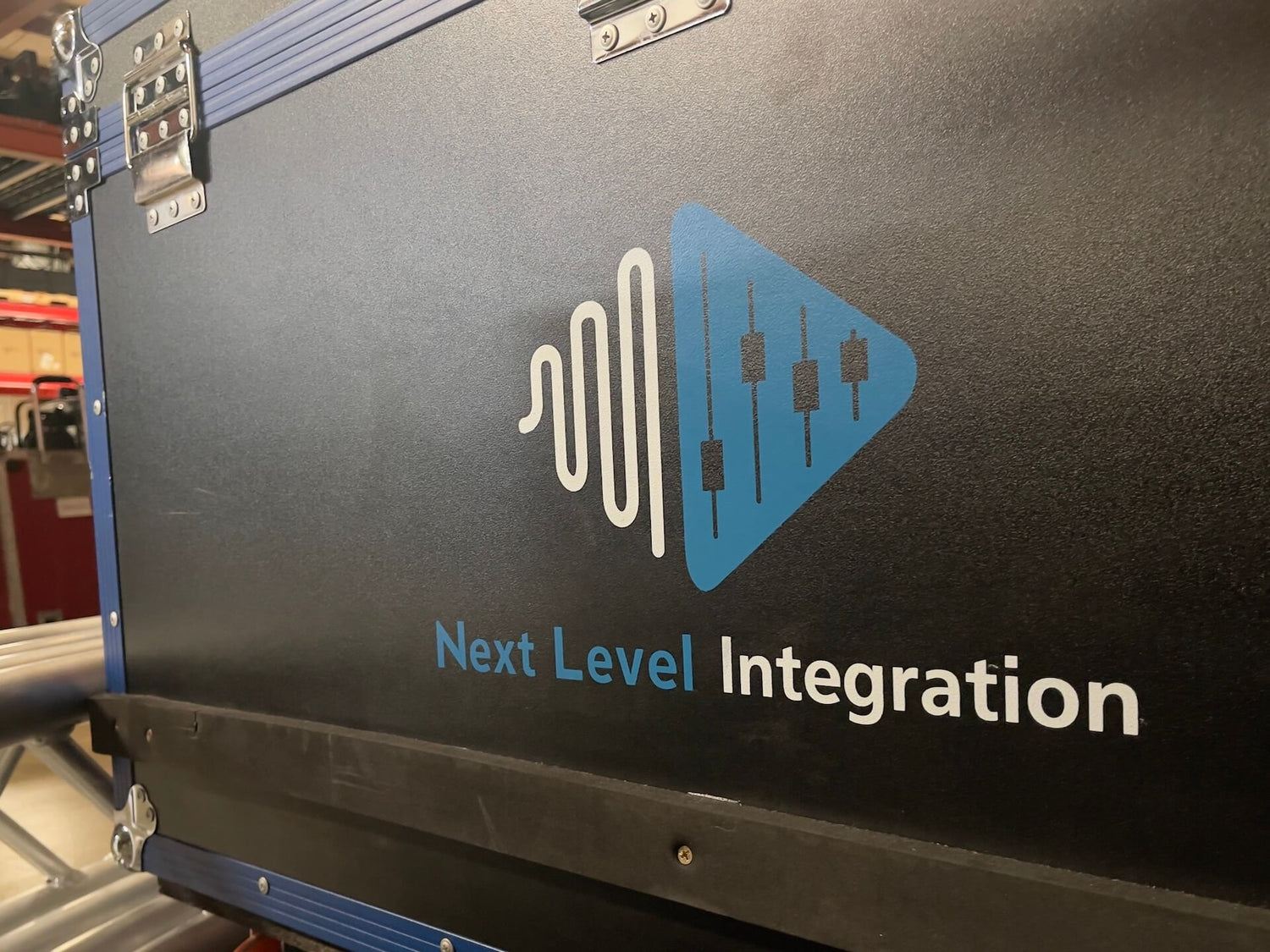 Next Level Integration logo on a road case